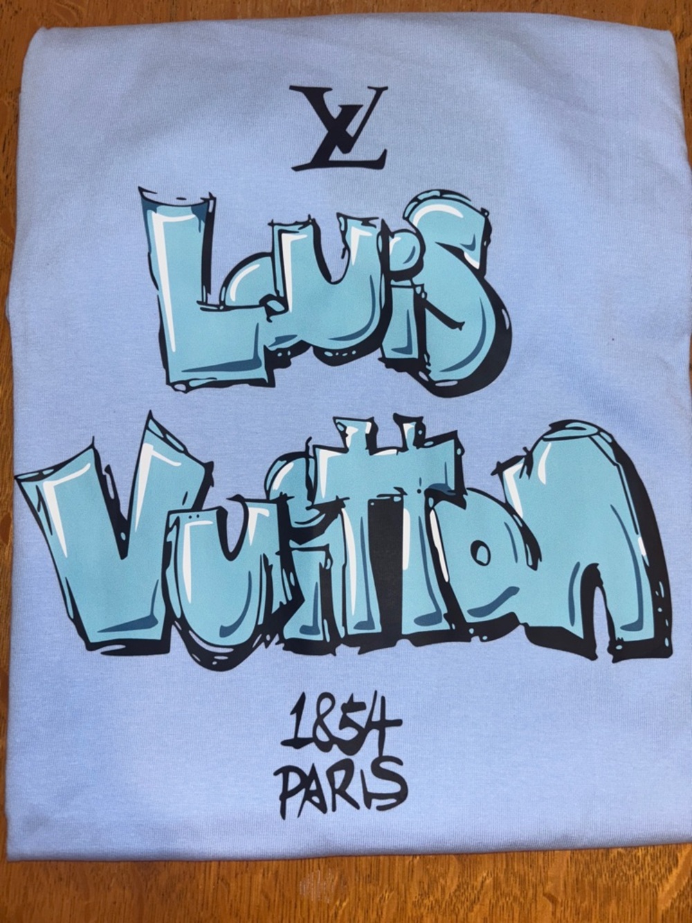 Louis Vuitton Light Blue Kids Graffiti Logo Tee read 👇